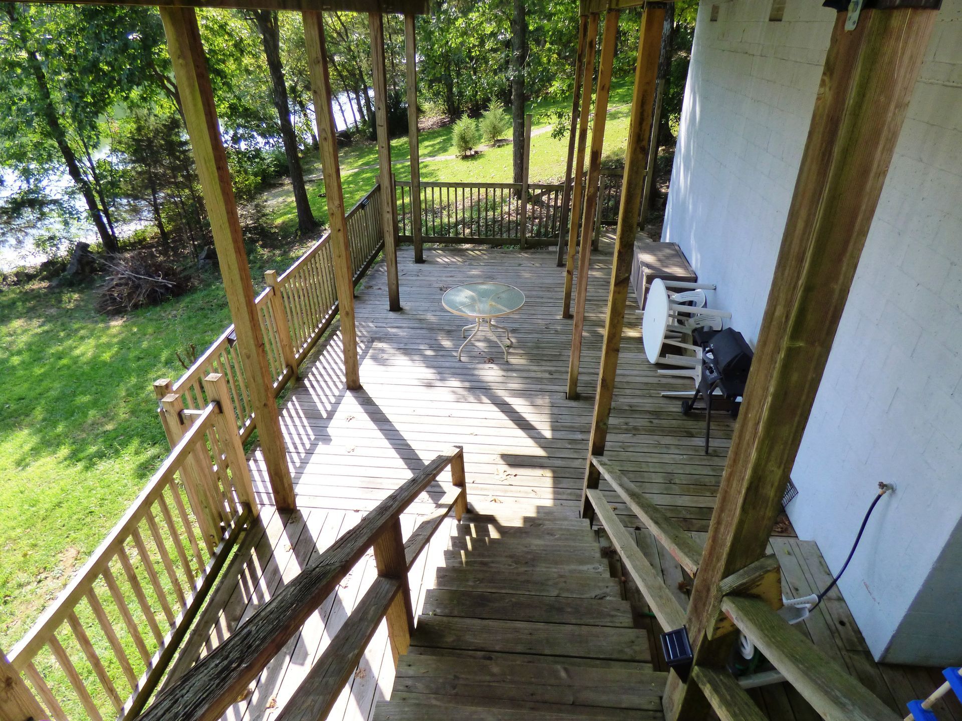 A wooden deck with stairs leading up to it