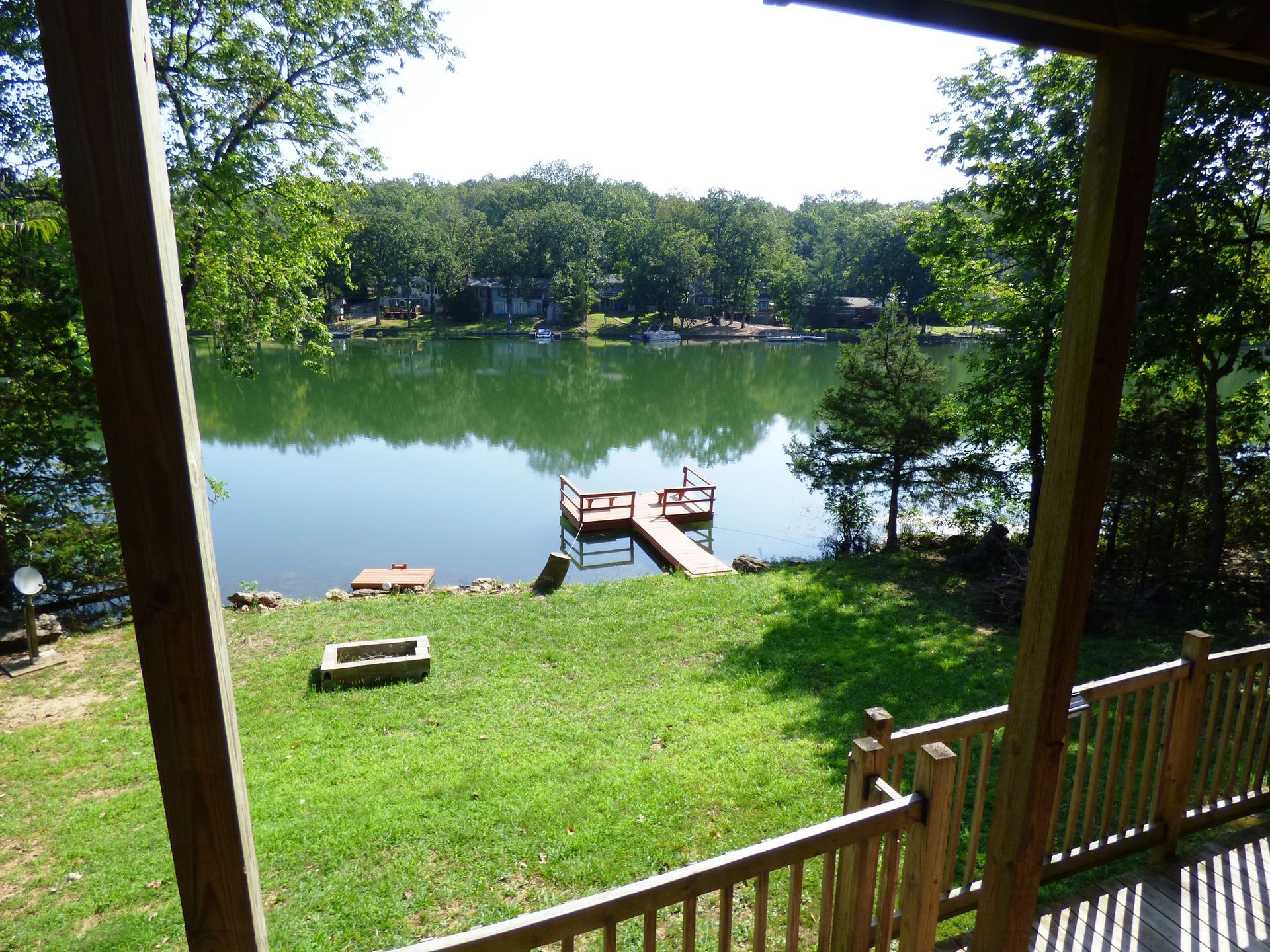 A view of a lake from the porch of a house