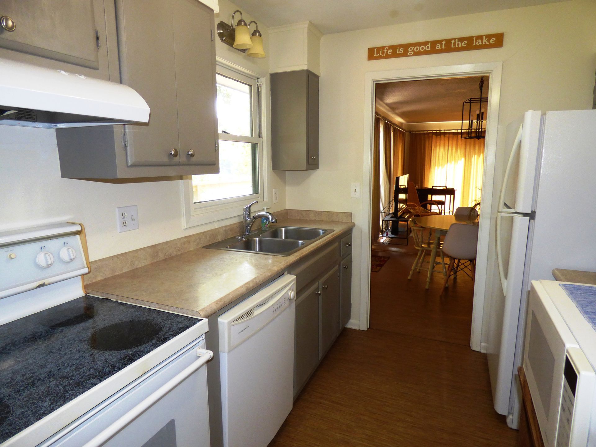 A kitchen with a sign that says life is good at this place