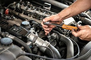 Engine Repair — Mechanic Repairing The Car Engine in Plymouth, MN