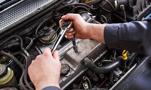 Engine Repair — Mechanic Fixing The Engine of the Car in Plymouth, MN