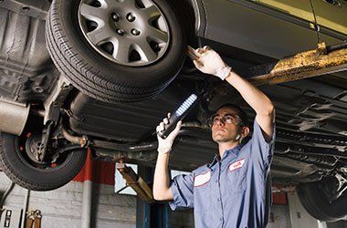 DOT Inspection — Man Inspecting The Tires in Plymouth, MN