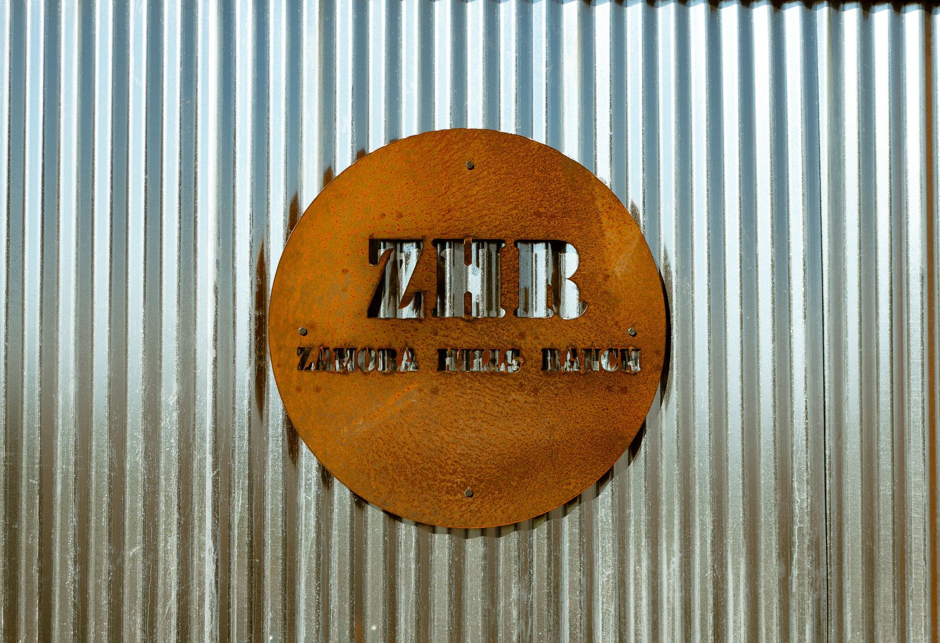 a rusty sign on a metal wall that says 72 mr
