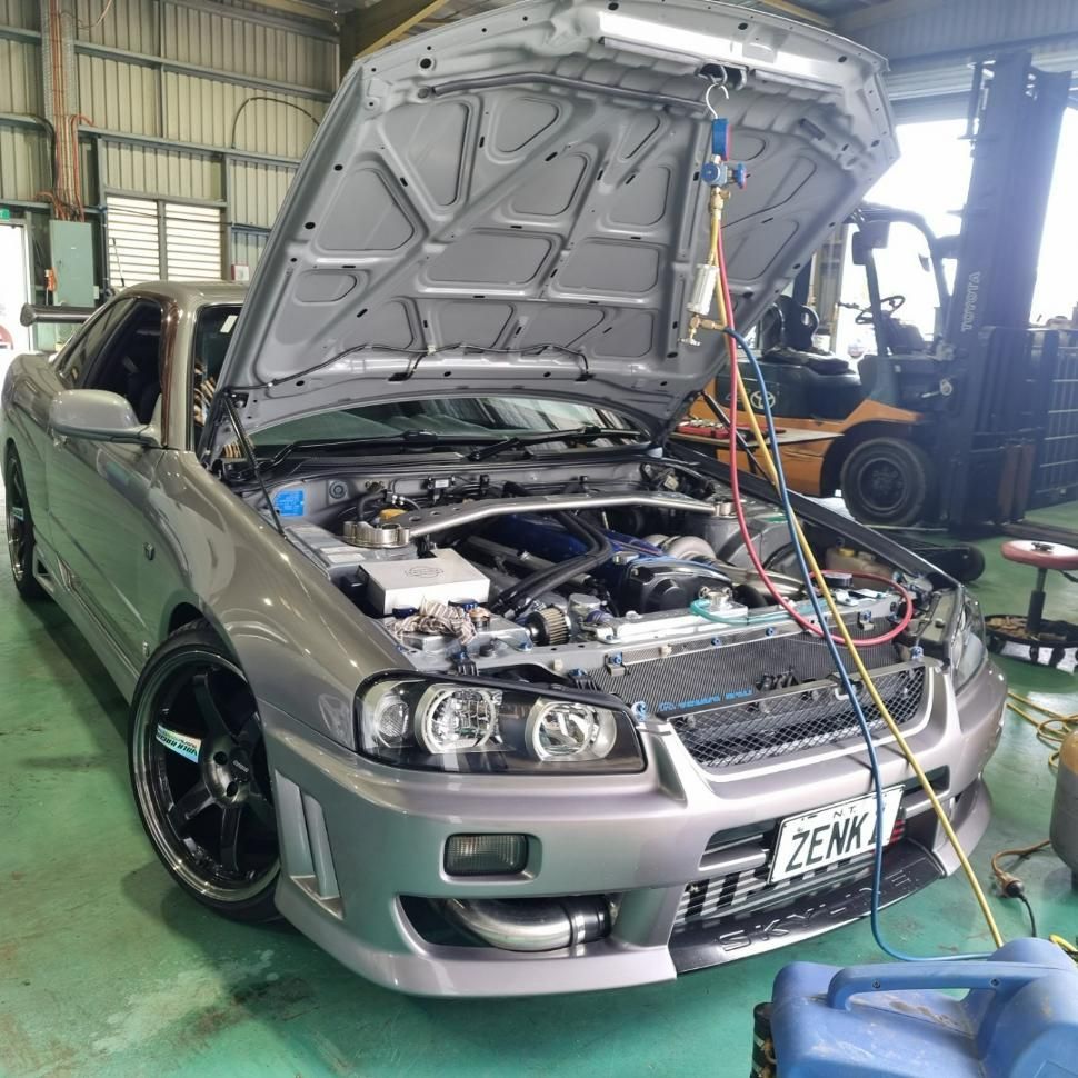 A Car with The Hood up Is Being Worked on In a Garage — D.J. Auto Electrics NT in Berrimah, NT