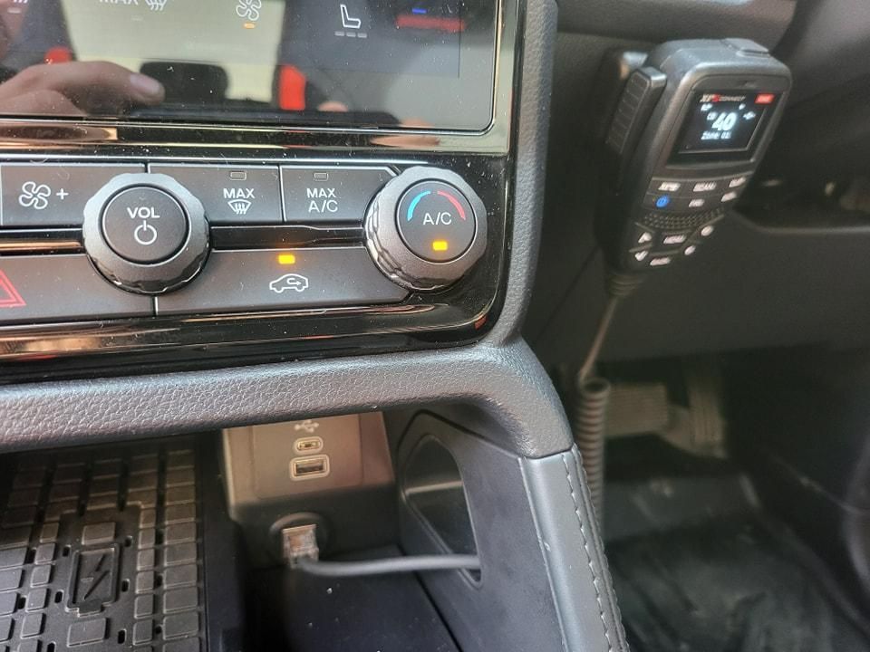 A Close up Of a Car Dashboard with A Radio and A AC Control — D.J. Auto Electrics NT in Berrimah, NT