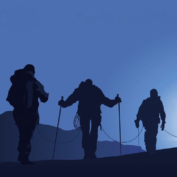 Three people are walking up a hill with hiking poles