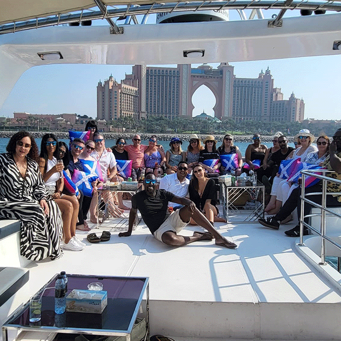 A group of people are posing for a picture on a boat