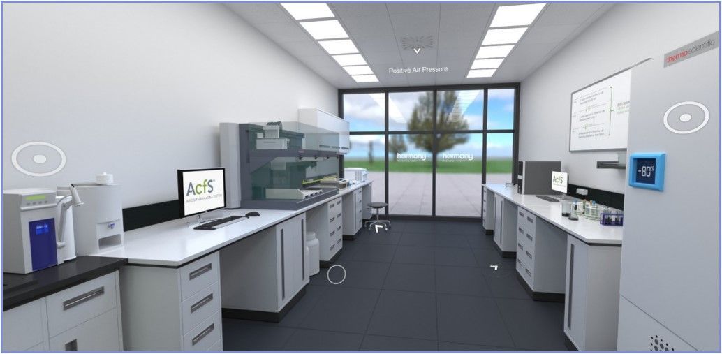 A laboratory interior with white counters, equipment, and a computer. Windows show an outdoor view.