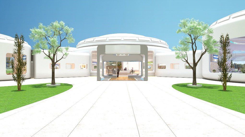 A futuristic white building with trees, lawn, and a path leading to the entrance under a blue sky.