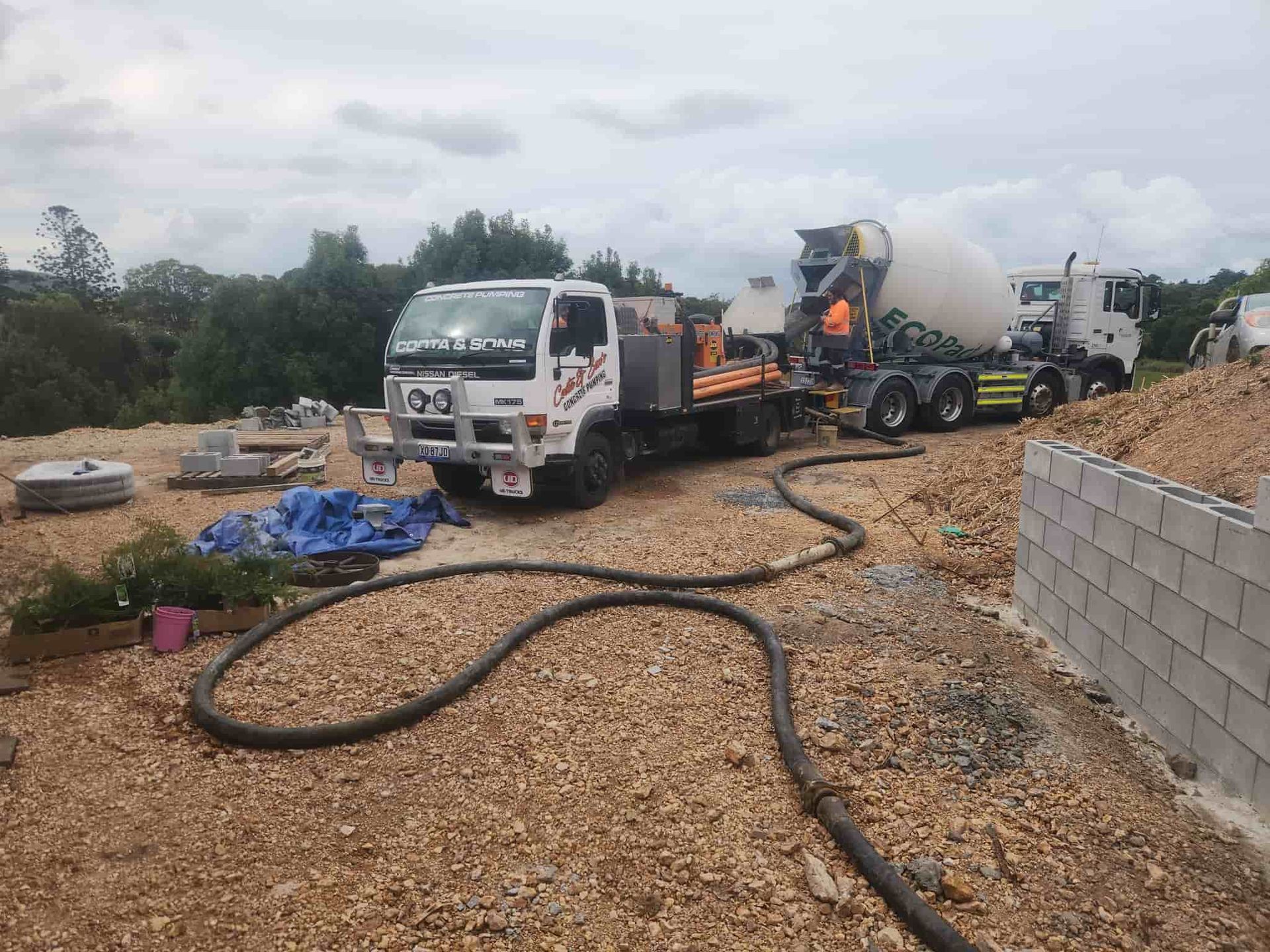 Concrete Truck Pouring Concrete on a Construction Site — Coota & Son's Concrete Pumping In South Gundurimba, NSW