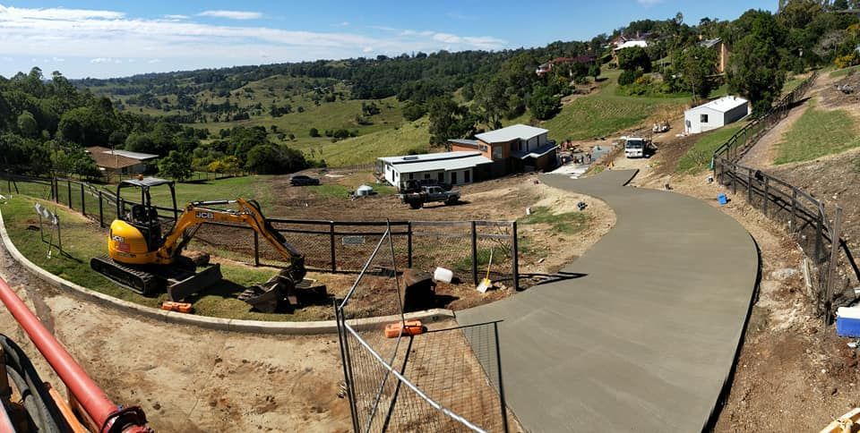 Construction Site With Freshly Poured Concrete Driveway — Coota & Son's Concrete Pumping In South Gundurimba, NSW