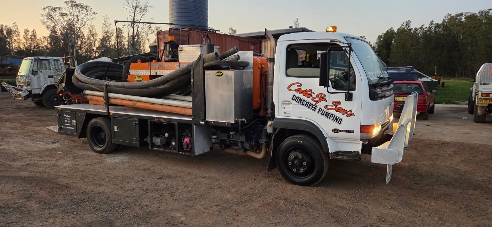 Yellow Concrete Truck Pouring Concrete on a Construction Site — Coota & Son's Concrete Pumping In South Gundurimba, NSW