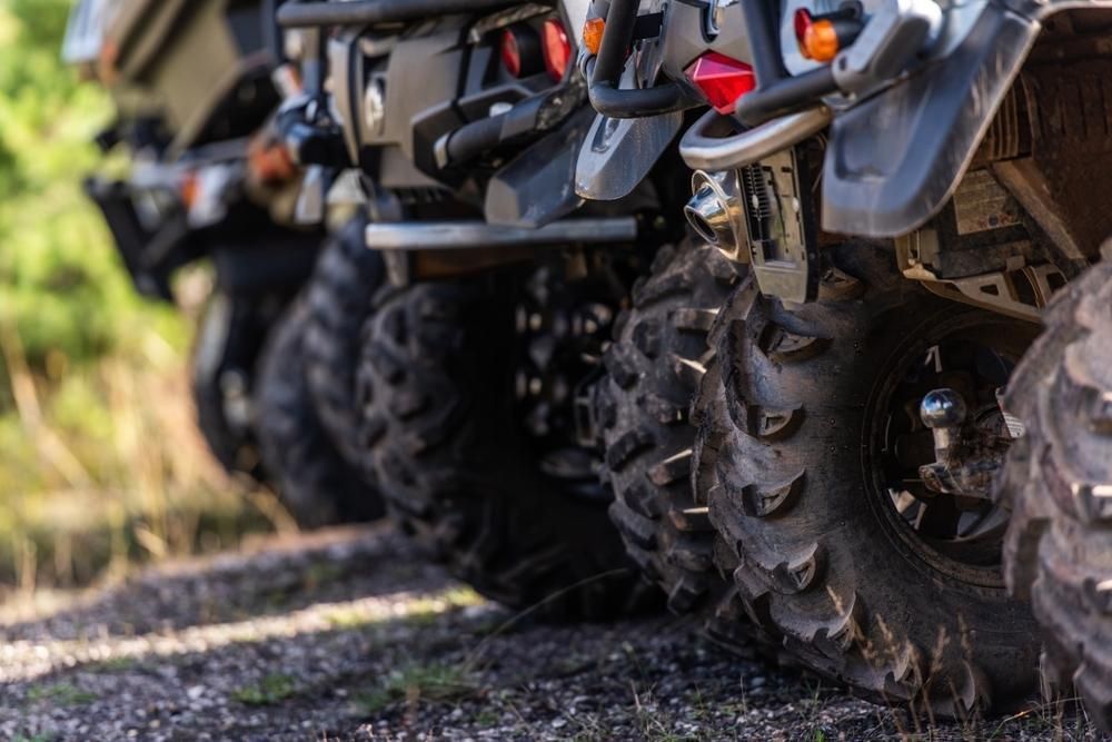 A Row Of Atvs Are Parked Next To Each Other On A Dirt Road — JBS Mobile In Richmond Hill, NSW