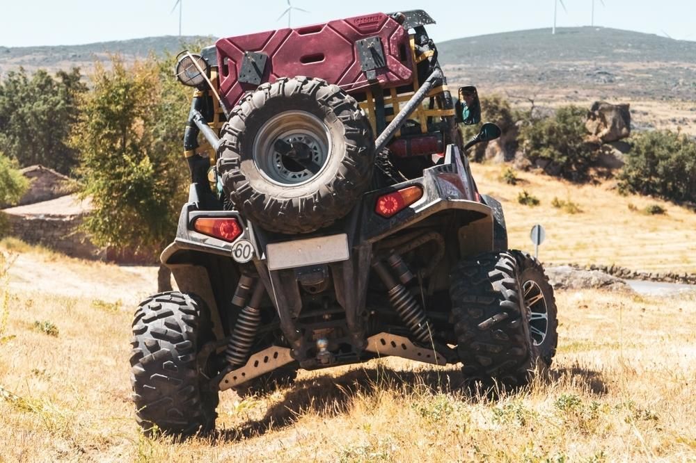 A Person Is Riding A Atv On A Dirt Road — JBS Mobile In Richmond Hill, NSW