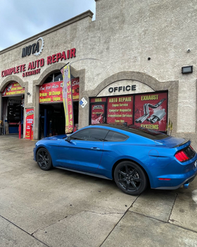 Blue car in front of our Corona Auto Repair Shop | Mota Auto Repair