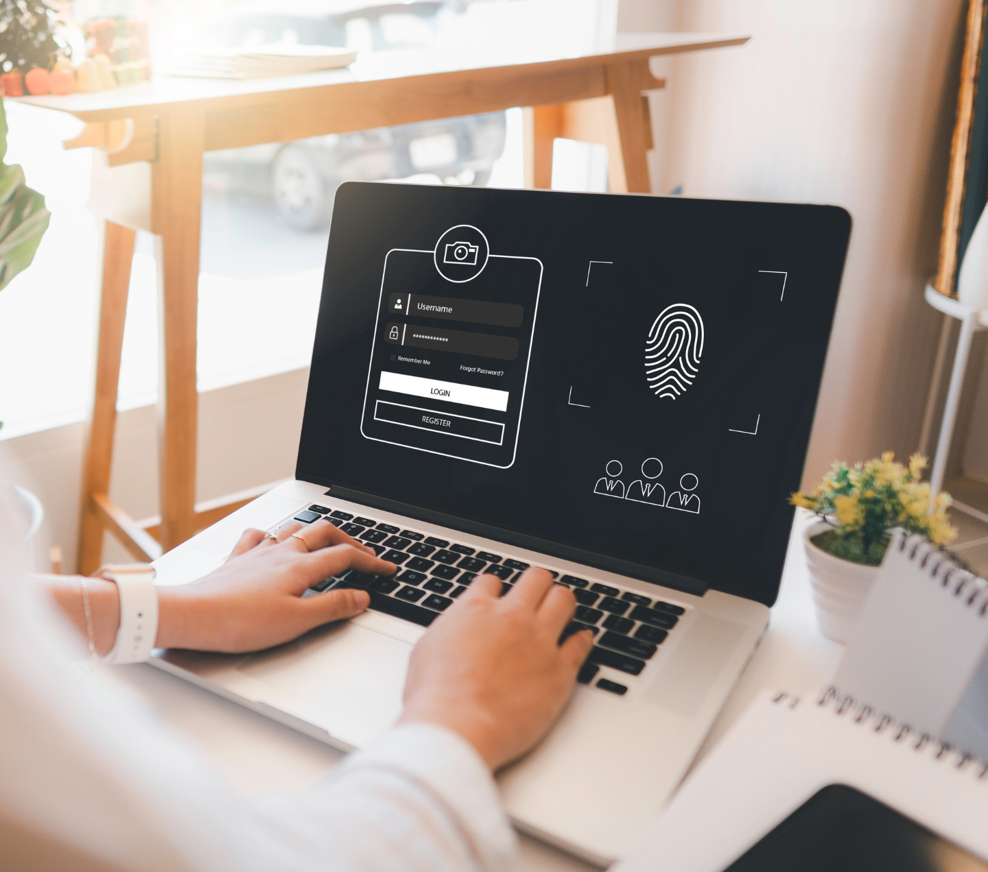 Una persona está escribiendo en una computadora portátil con una huella digital en la pantalla.