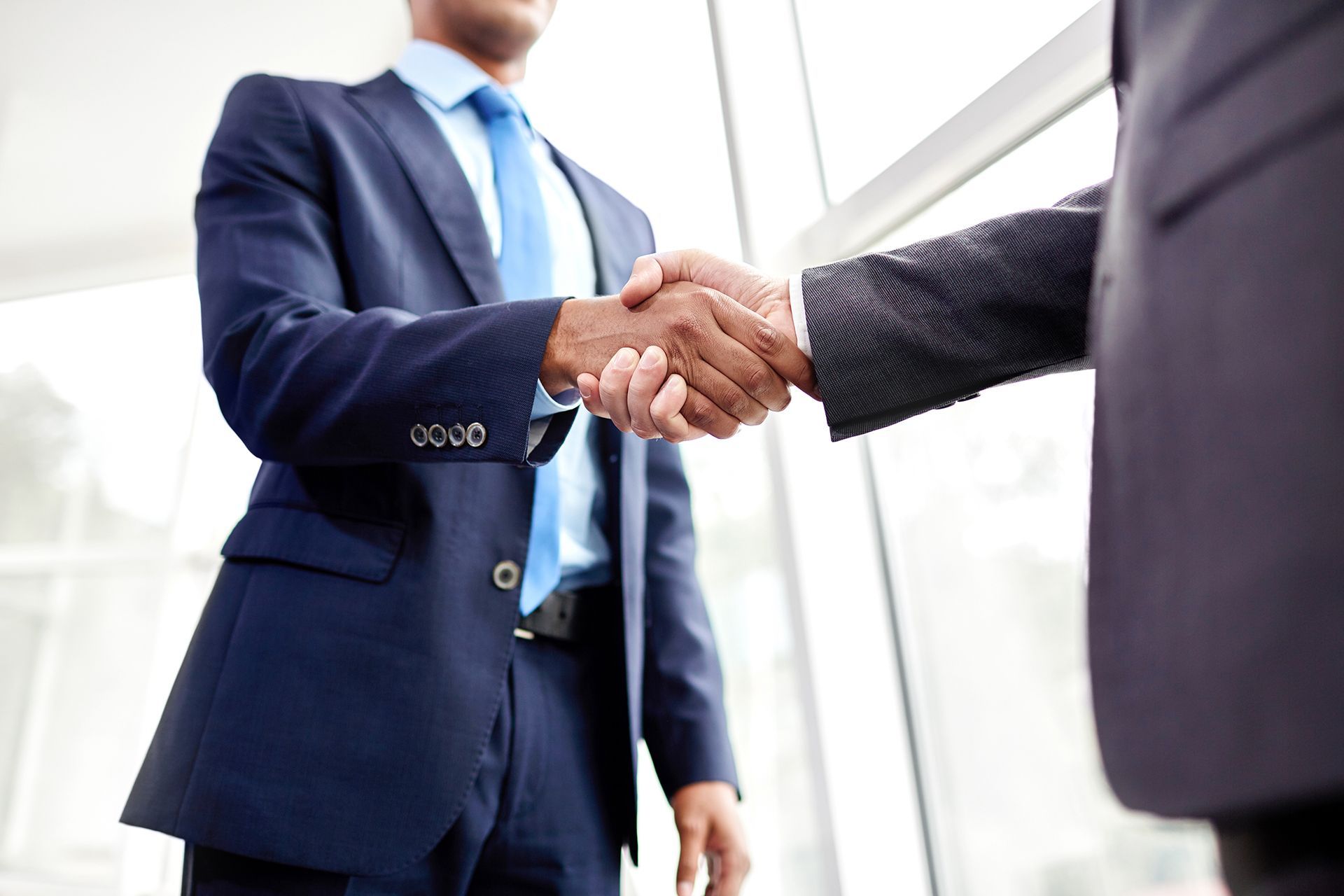 Private Investigator Shaking Hands With Client