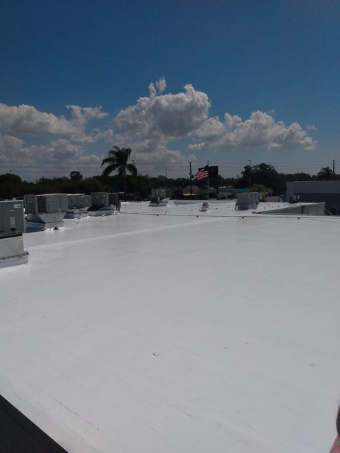 A white roof with a blue sky in the background.