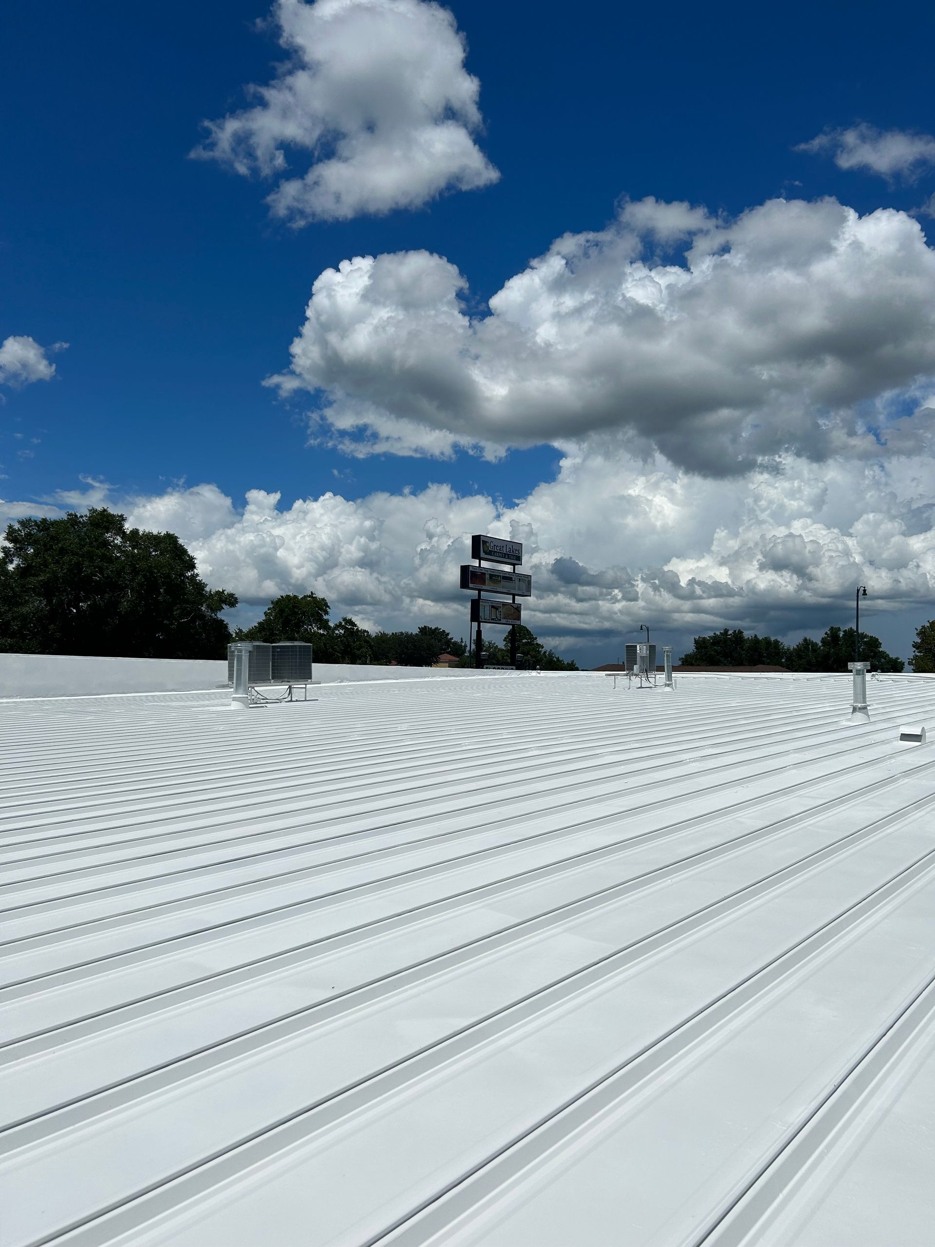An elastomeric roof coating on a commercial roof