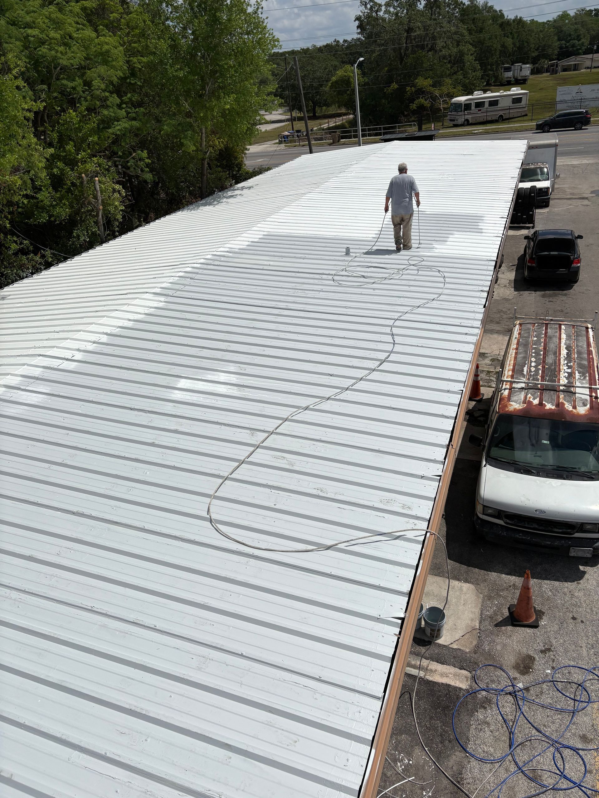 Florida commercial roof coating in progress by WeatherTite Coating