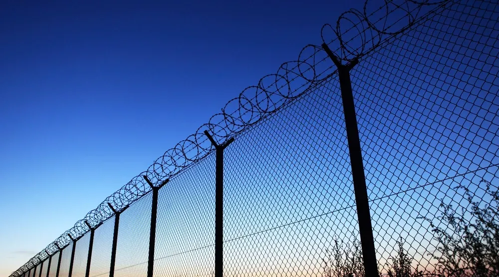 A Steel Mesh Security Fence With Rolled Barbed Wire On Top — True North Fencing In Noonamah, NT