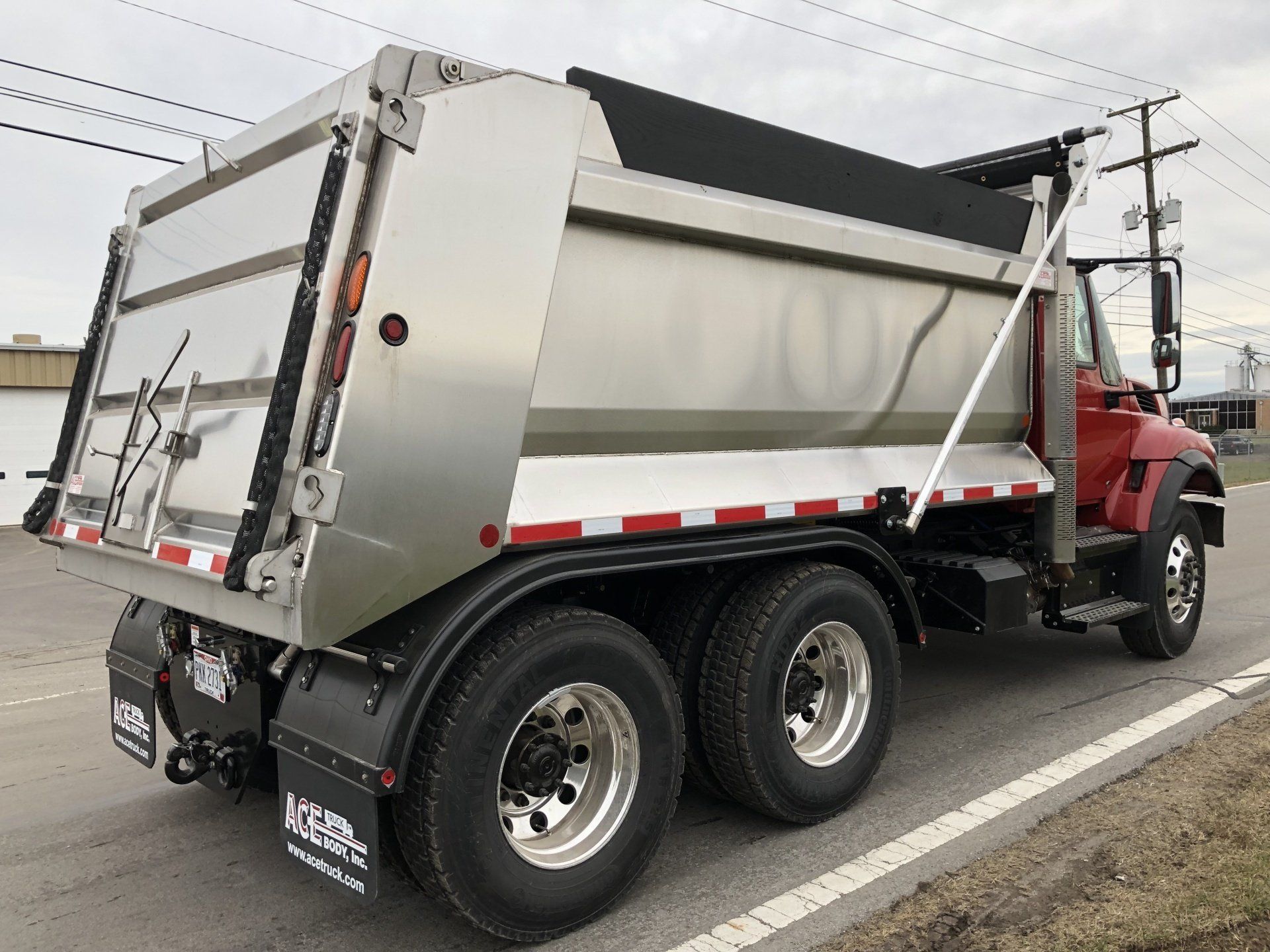 A Water Truck Spraying The Street - Grove City, OH - Ace Truck Body Inc
