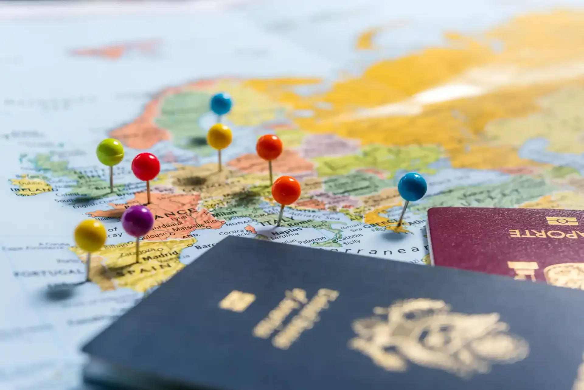 Map with colorful pins, passports, travel planning concept.