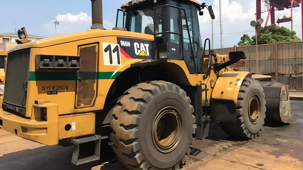 Image of a yellow bulldozer working on a job.