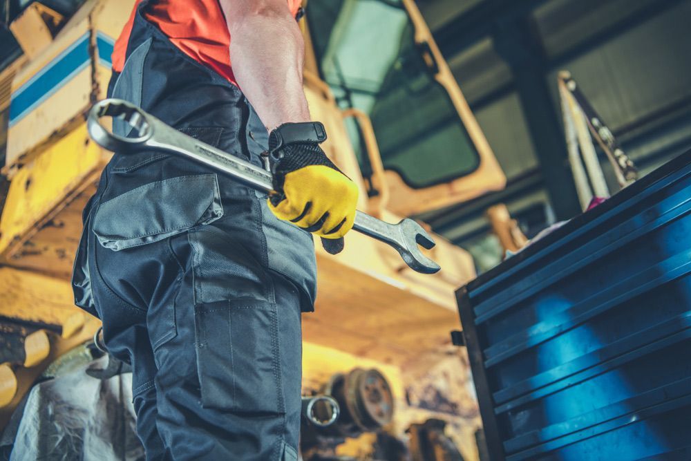 man holding a wrench