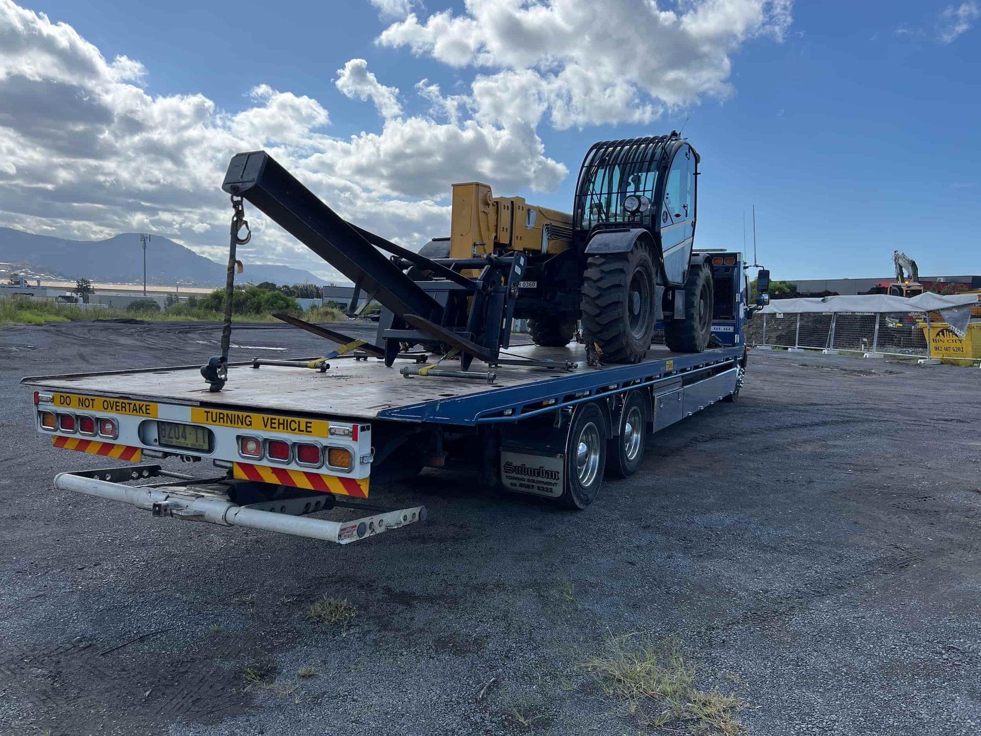 Heavy Machine on a Transport Truck — Plant Maintenance in Unanderra, NSW