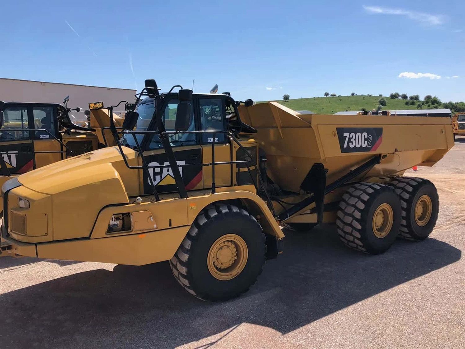 A Yellow Caterpillar 730c Articulated Dump Truck