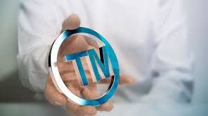 A person is putting a flyer in a mailbox that says `` uncover hidden savings ''.