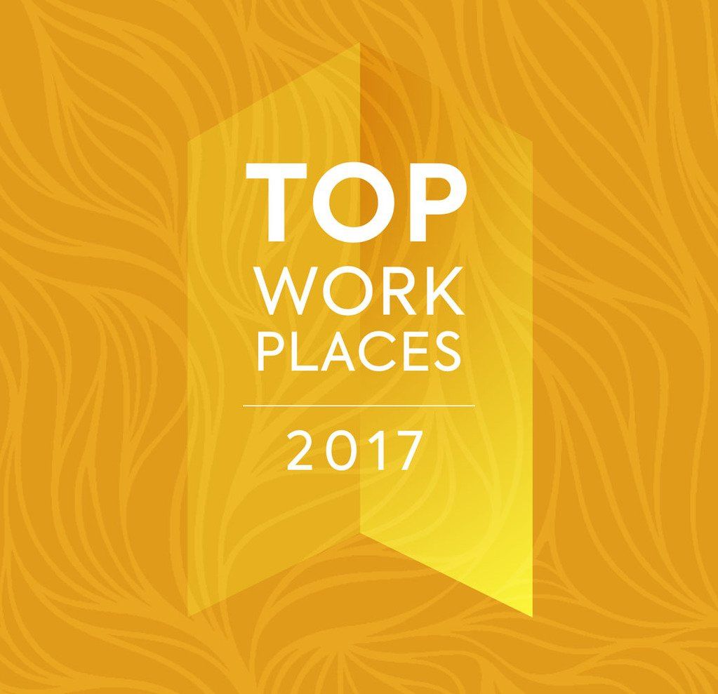 The top work places logo for 2017 is on a yellow background.