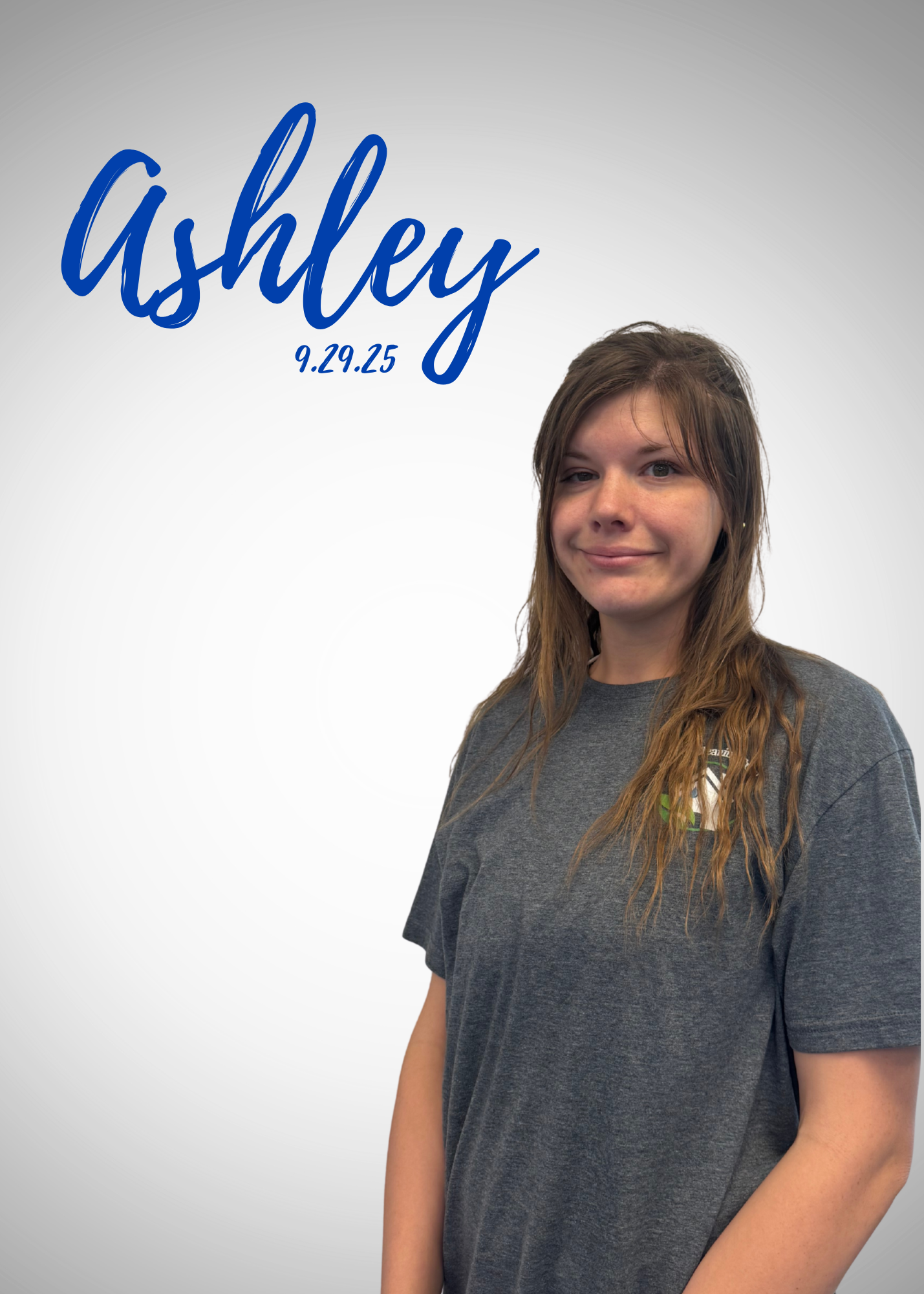 A woman is cleaning a bathroom counter with a towel.