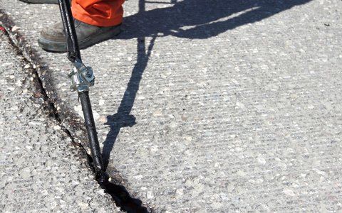 Asphalt Services — Sealing Cracked On The Road In Prescott, AZ