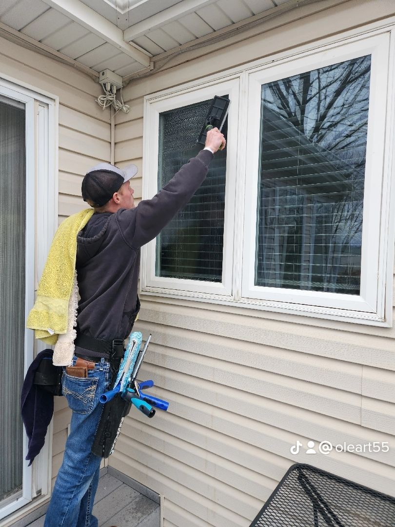 Man cleaning window of a home – Spring Hill, KS - O’Leary Window Washing