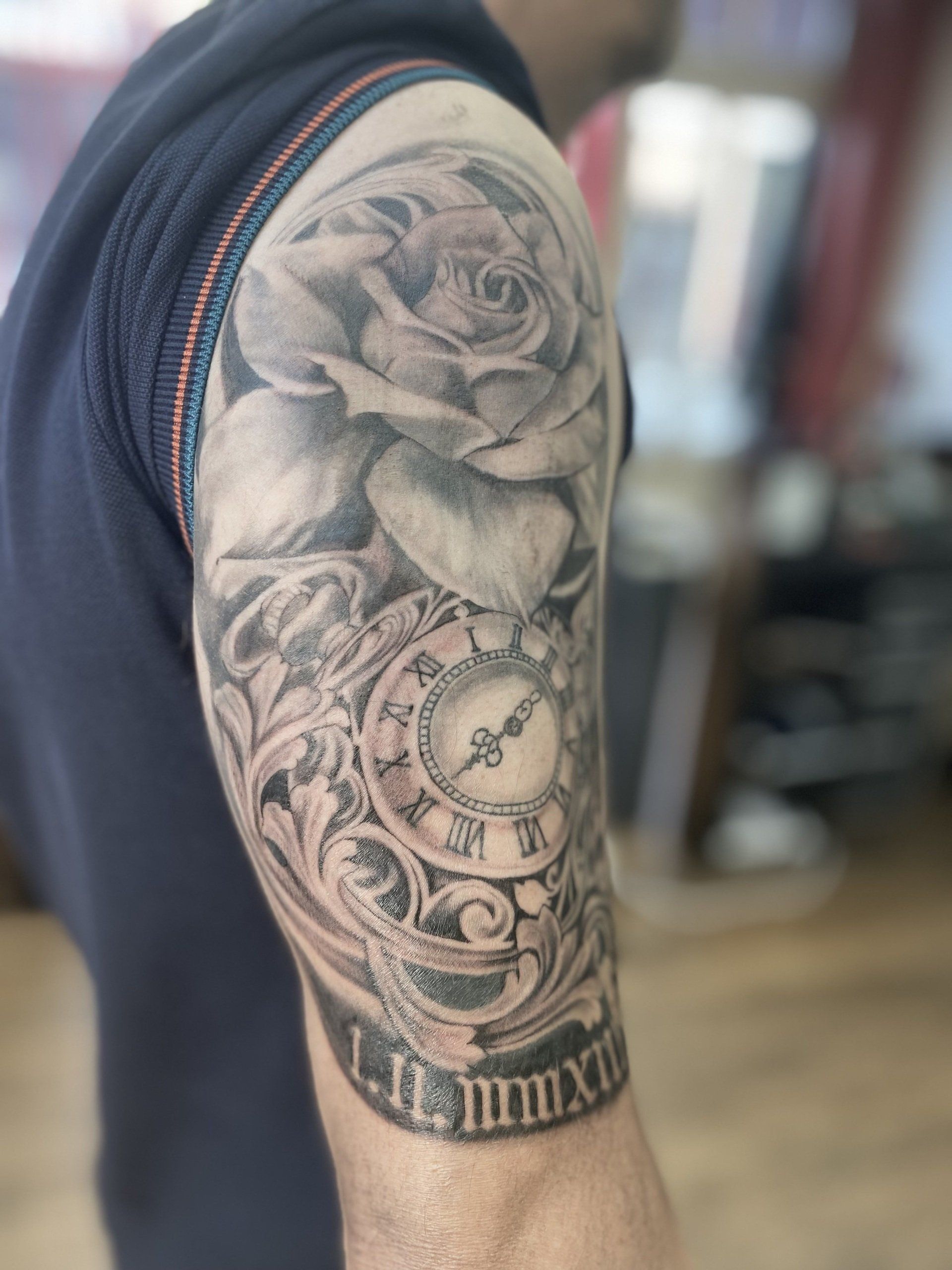 Black and grey tattoo rose and pocket watch