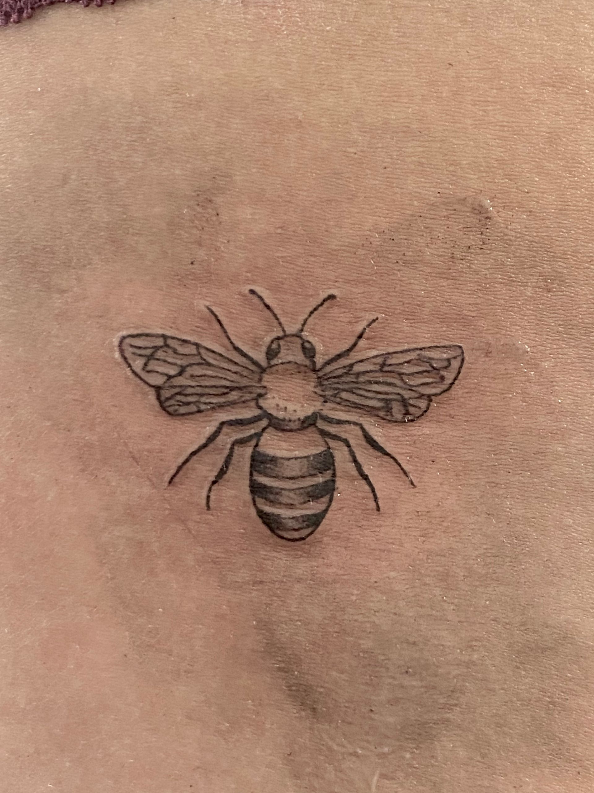 Small linework bee tattoo
