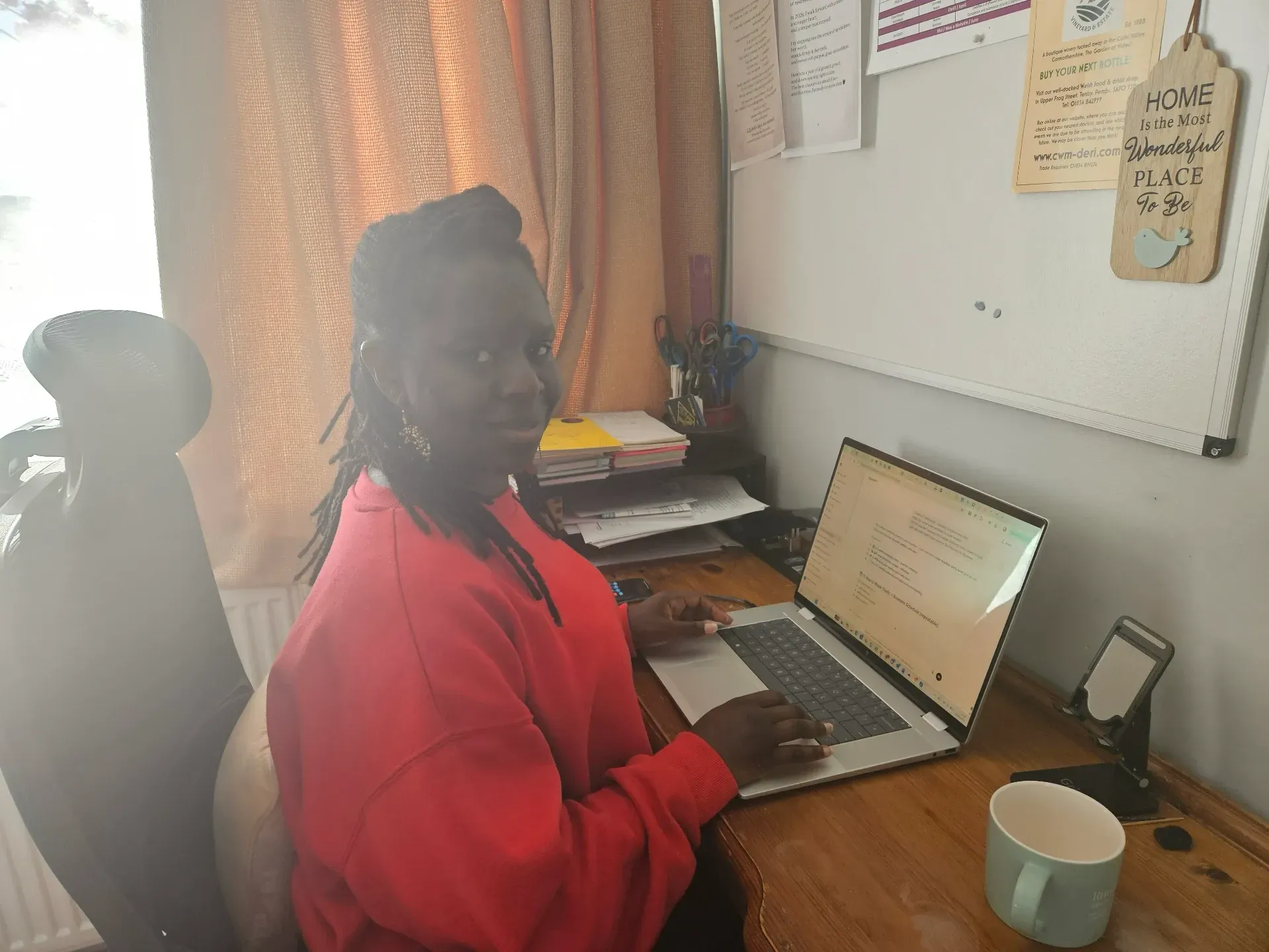 Isamba working at desk as Virtual Assistant