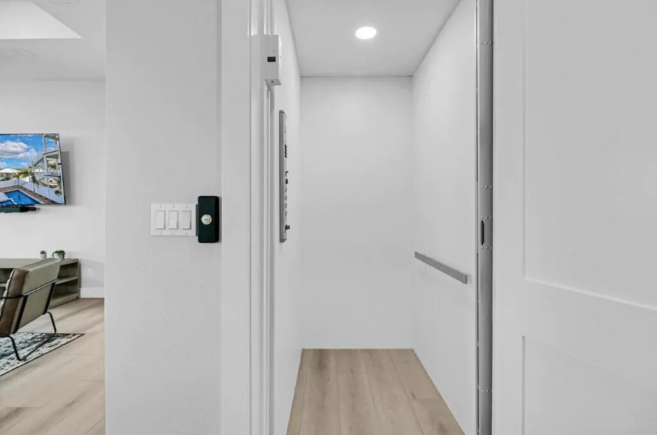 Elevator  in custom Port Aransas home by Innovo Residential