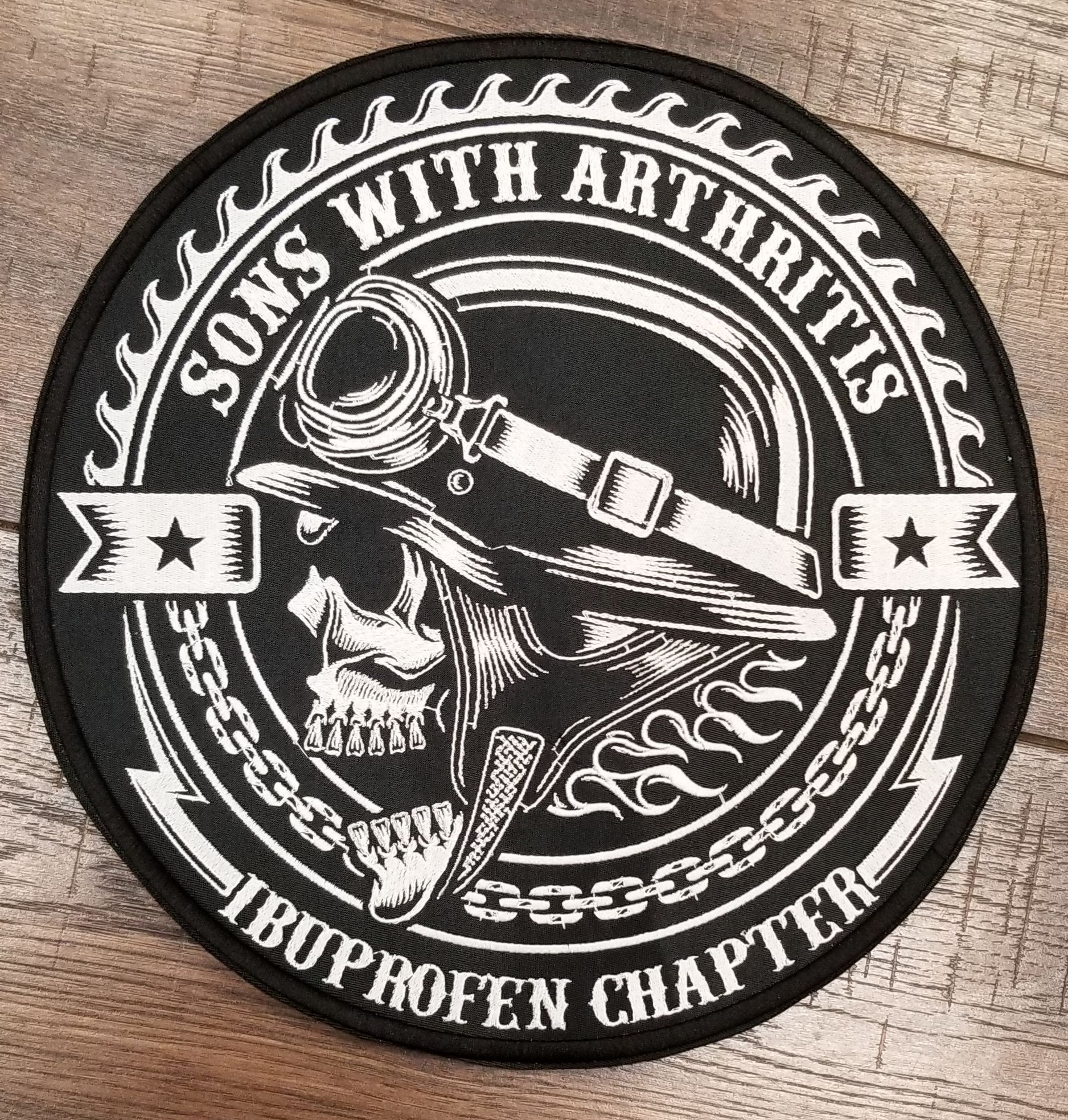 Black and white patch with a skull wearing goggles, 