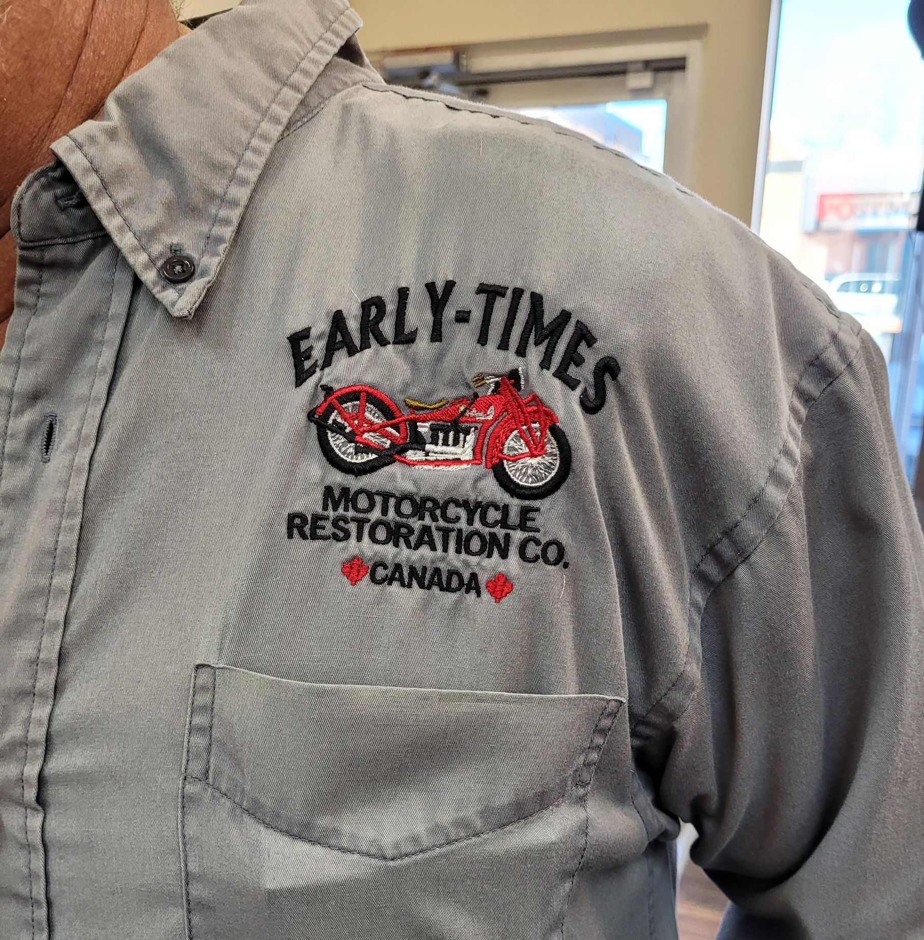 Gray work shirt with embroidered logo:
