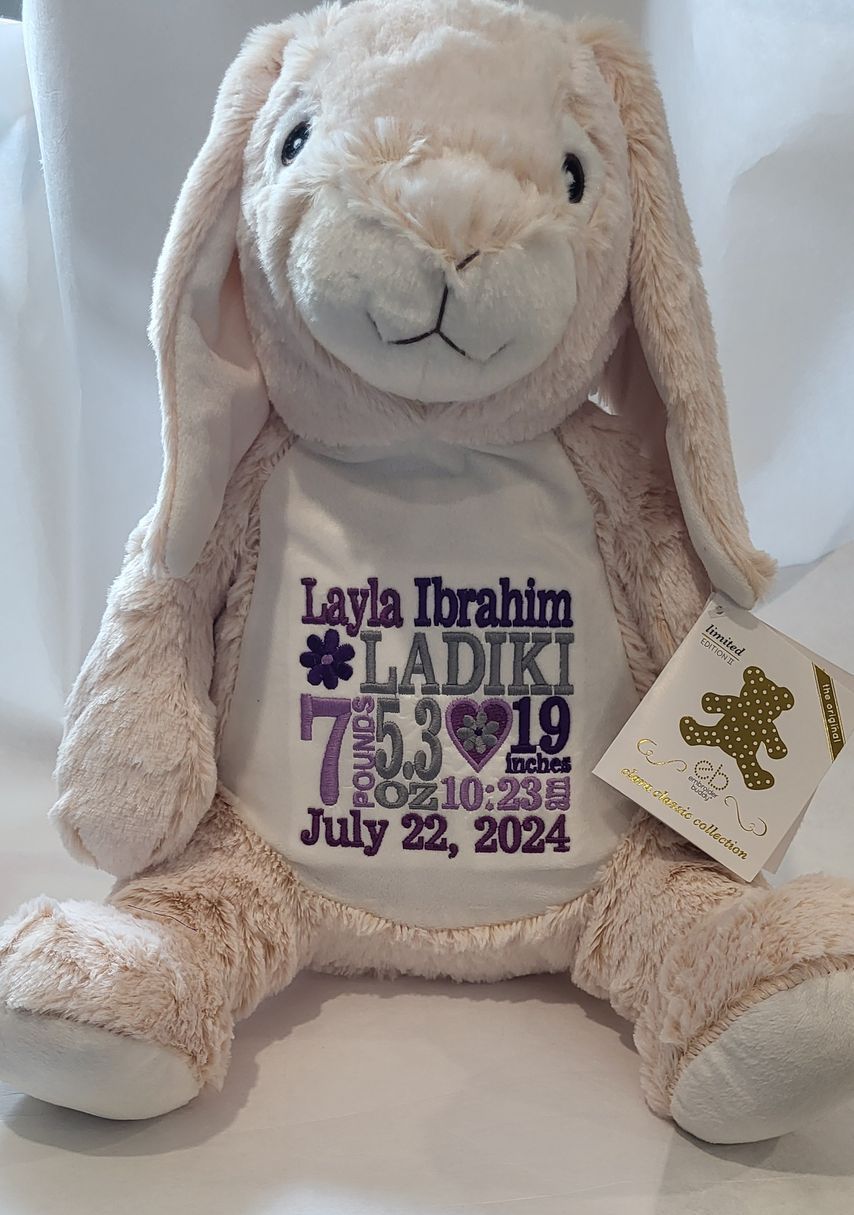 Pink stuffed bunny with personalized embroidered details for baby Layla.