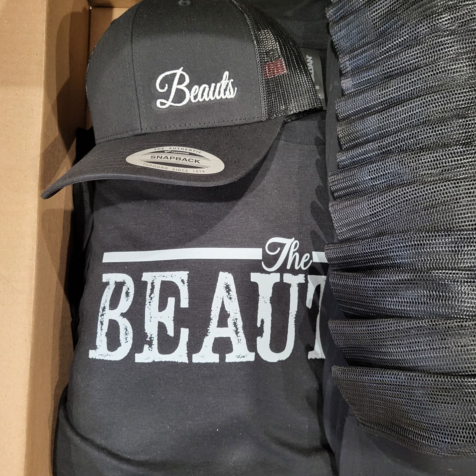 Black cap and shirt with the word