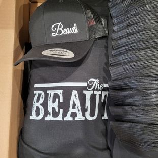 Black cap and shirt with the word 