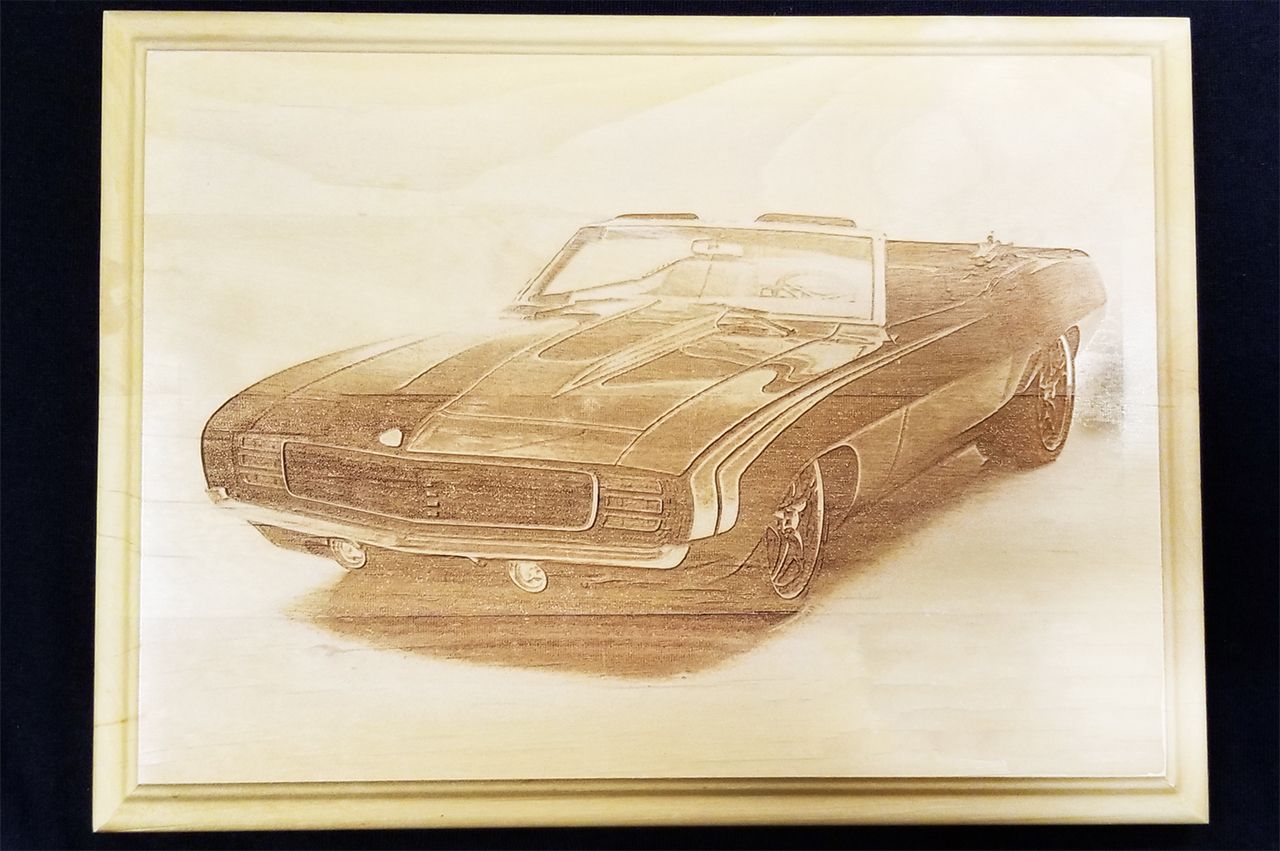 Wooden plaque with a laser-engraved image of a classic convertible car.