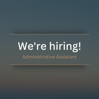 A man and a woman standing in front of a building with the number 252 on it