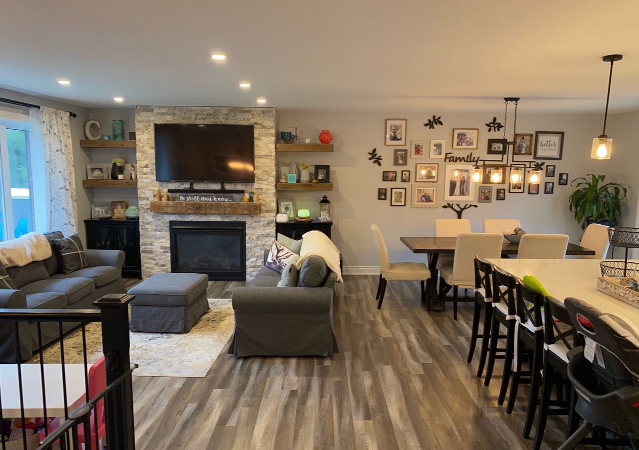 A living room filled with furniture and a fireplace.
