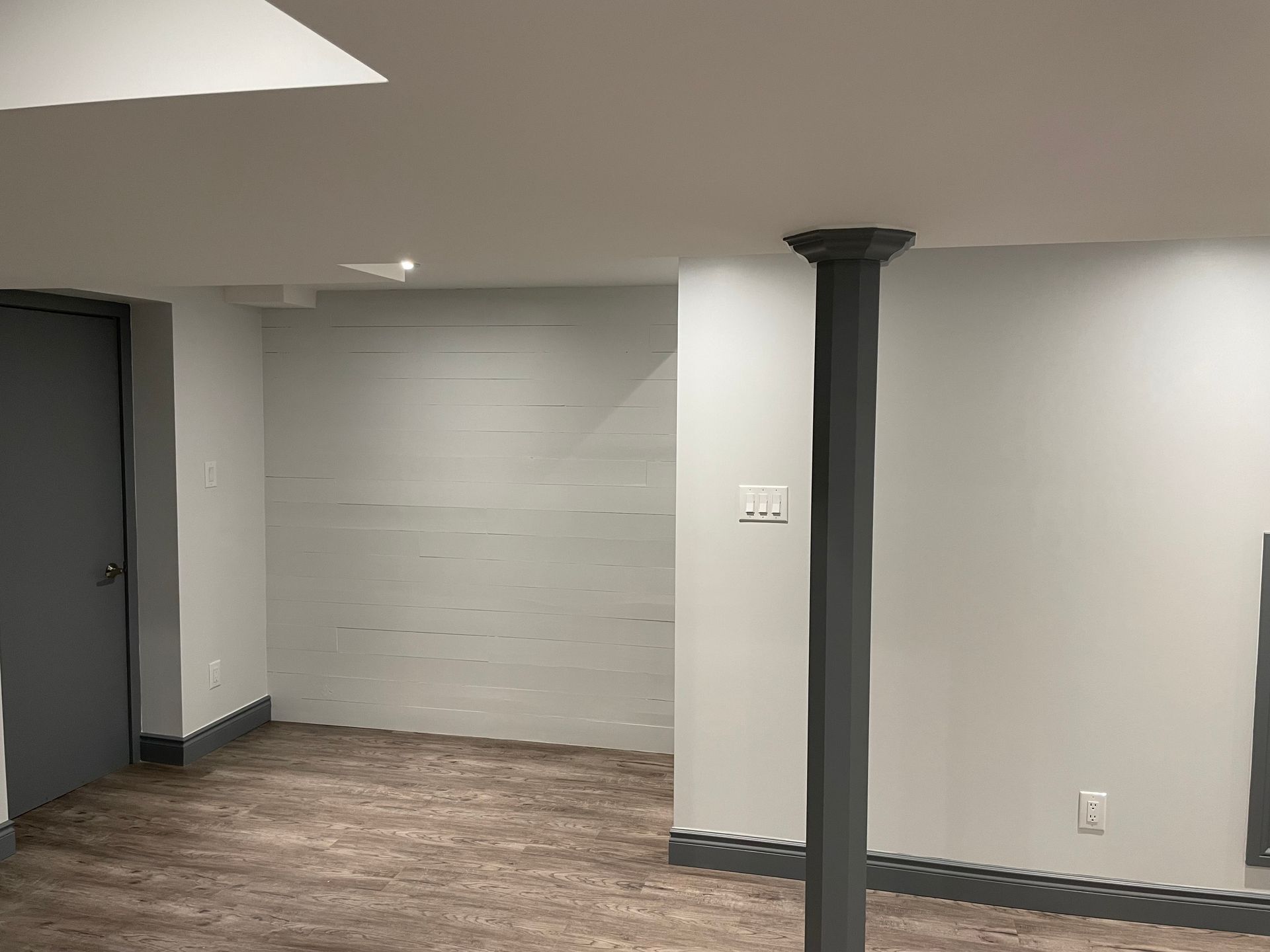 There is a pillar in the middle of the room.