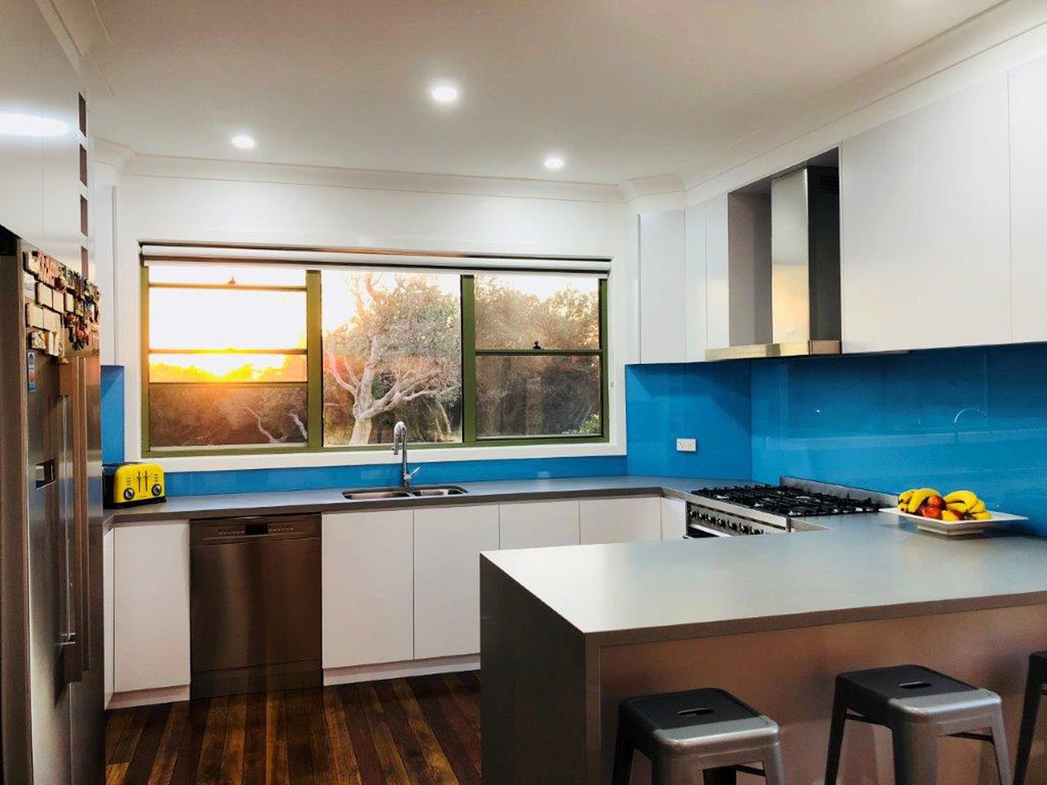 A Kitchen with a Blue Wall Splashback — Glass Windows & Doors in Shoalhaven, NSW